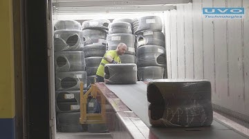 Loading and unloading car tyres using a telescopic boom conveyor from FMH Conveyors