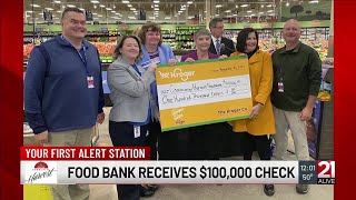Kroger hosts ribbon cutting, presents six-figure donation to Community Harvest Food Bank