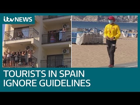 Tourists in Spain ignore emergency measures despite rise in coronavirus cases | ITV News