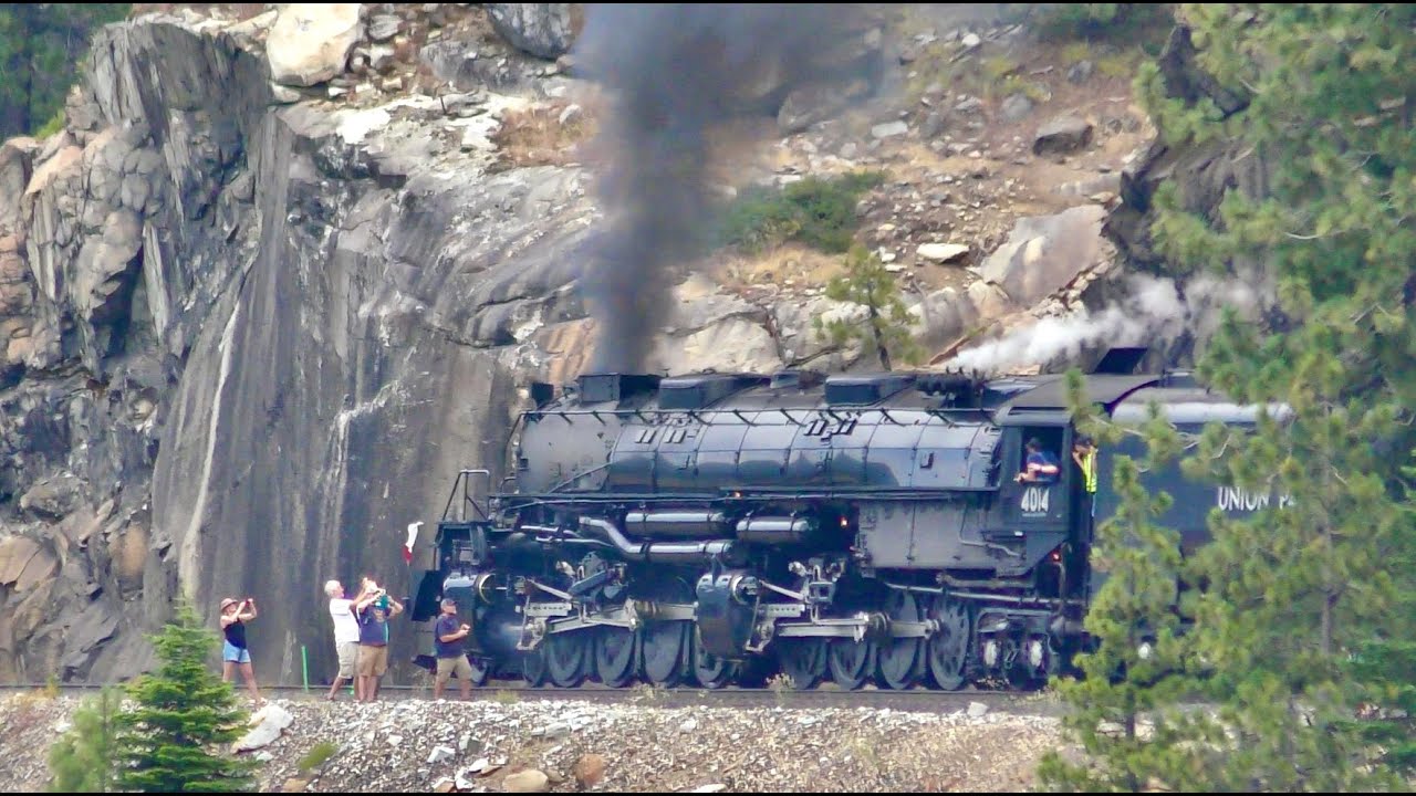 UNION PACIFIC 'Big Boy' 4014 steam locomotive and its train pass some ...