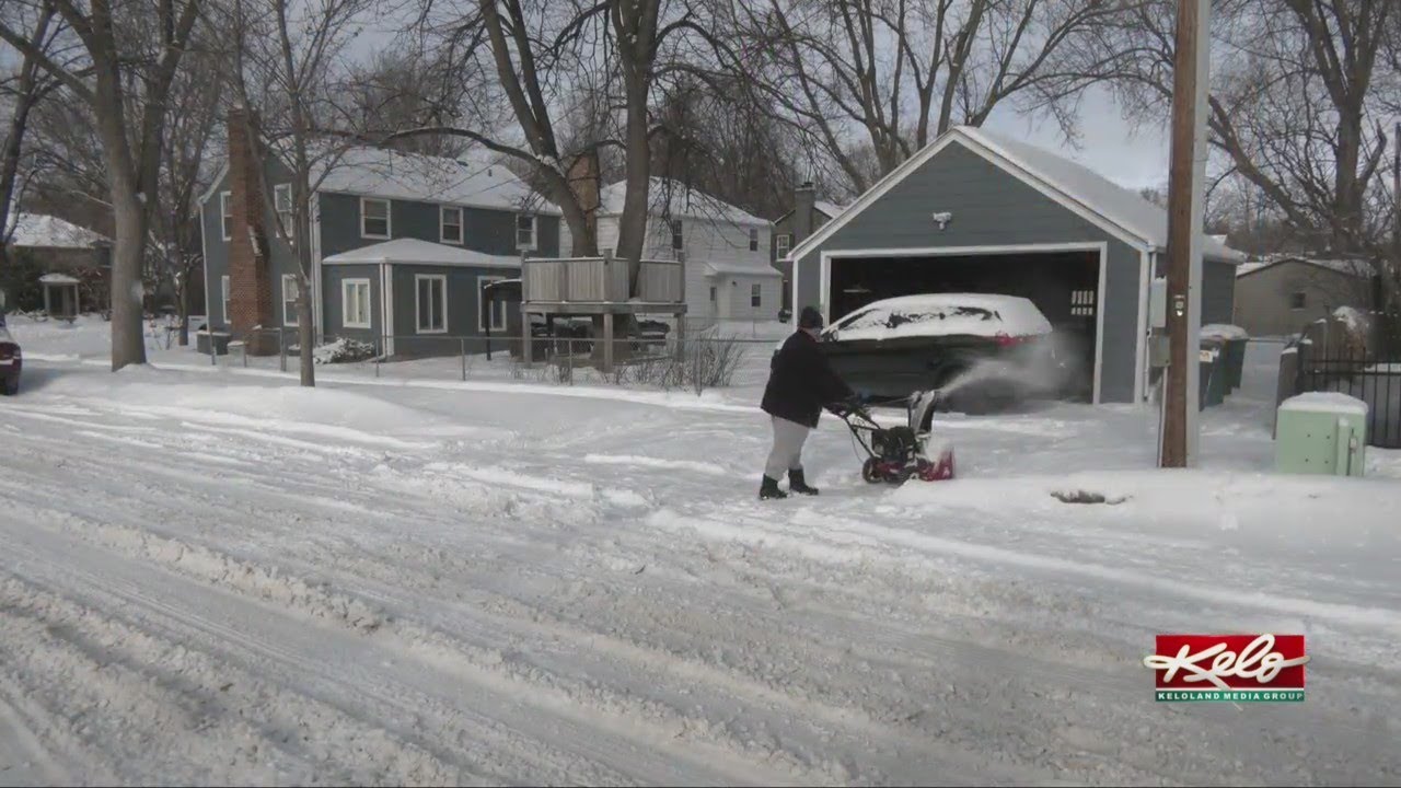 Cleaning up after Thursday's snow - YouTube