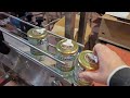 Wrap-around labeling machine for honey jars includes tamper evident and applying position by Tadbik