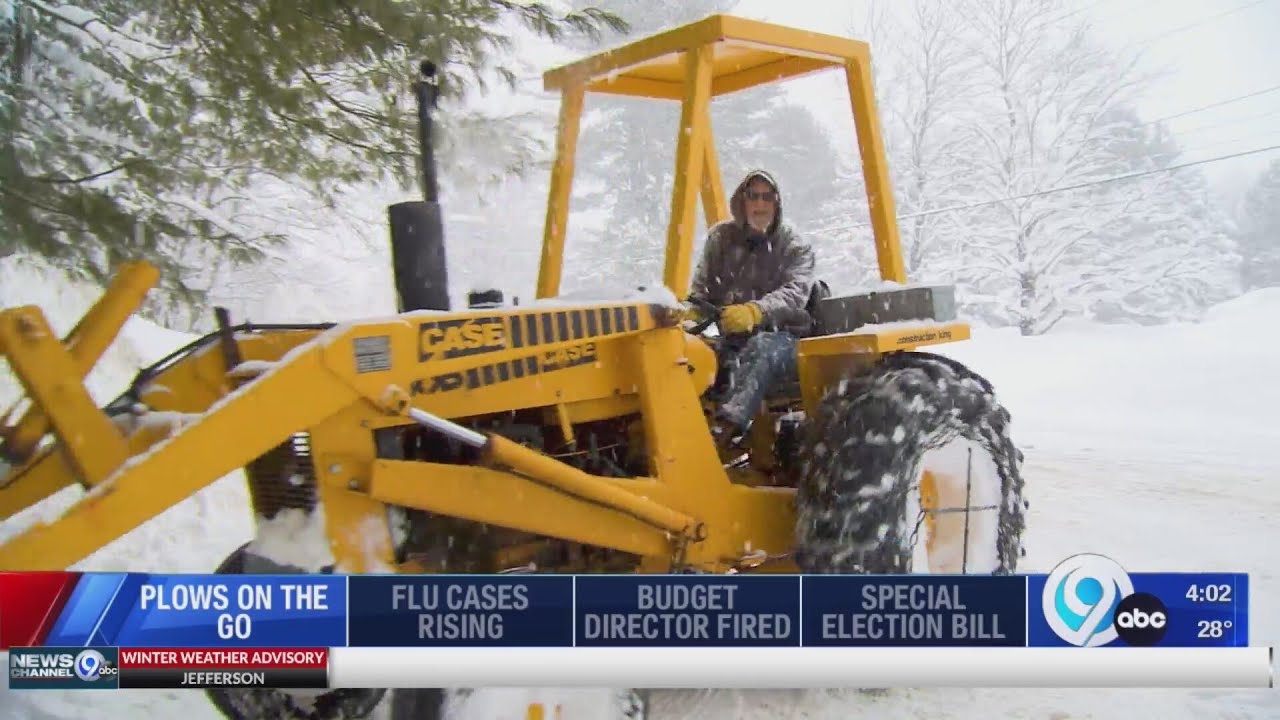 Hastings man uses bucket loader to clean up snow in his driveway - YouTube