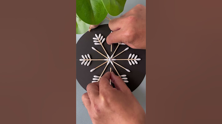 Use cotton swabs to make beautiful snowflakes. Handmade DIY. Kindergarten handmade. Parent-child