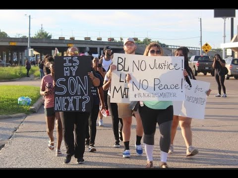 Protesters march in front of the Grayson County Courthouse on May 31, 2020