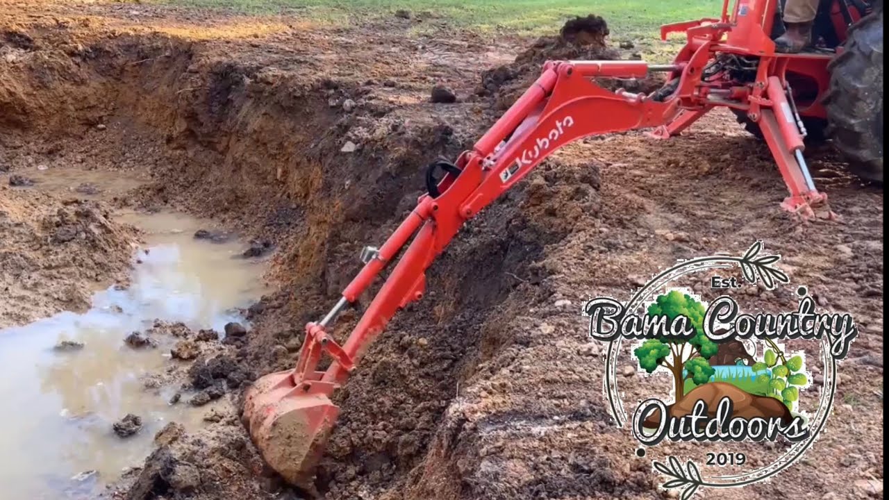digging NEW POND #6 kubota L2501 bh77 we hit a spring.. - YouTube