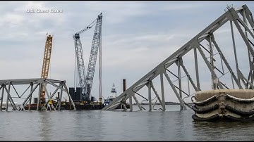 Crews work to open temporary channel near Baltimore bridge collapse