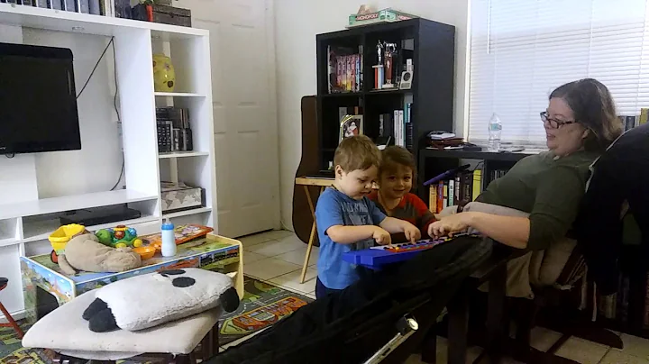 Logan with Grandma Terri. Piano time