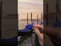 Painting sun on posts in Venice