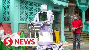 Robot delivers food, "get well soon" messages to Indonesians in Covid-19 isolation