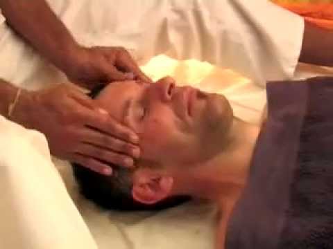 Male therapist delivers Kerala Ayurveda massage in India 