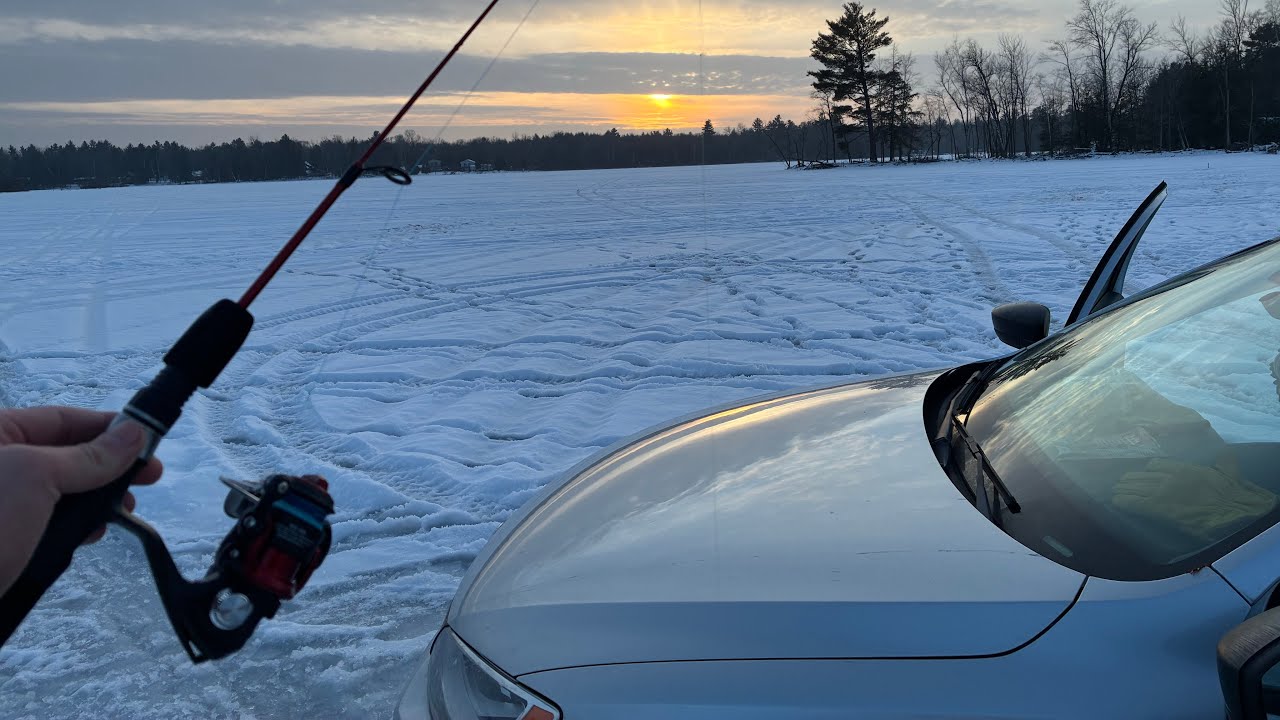 Ice fishing in a (CAR) in Wisconsin
