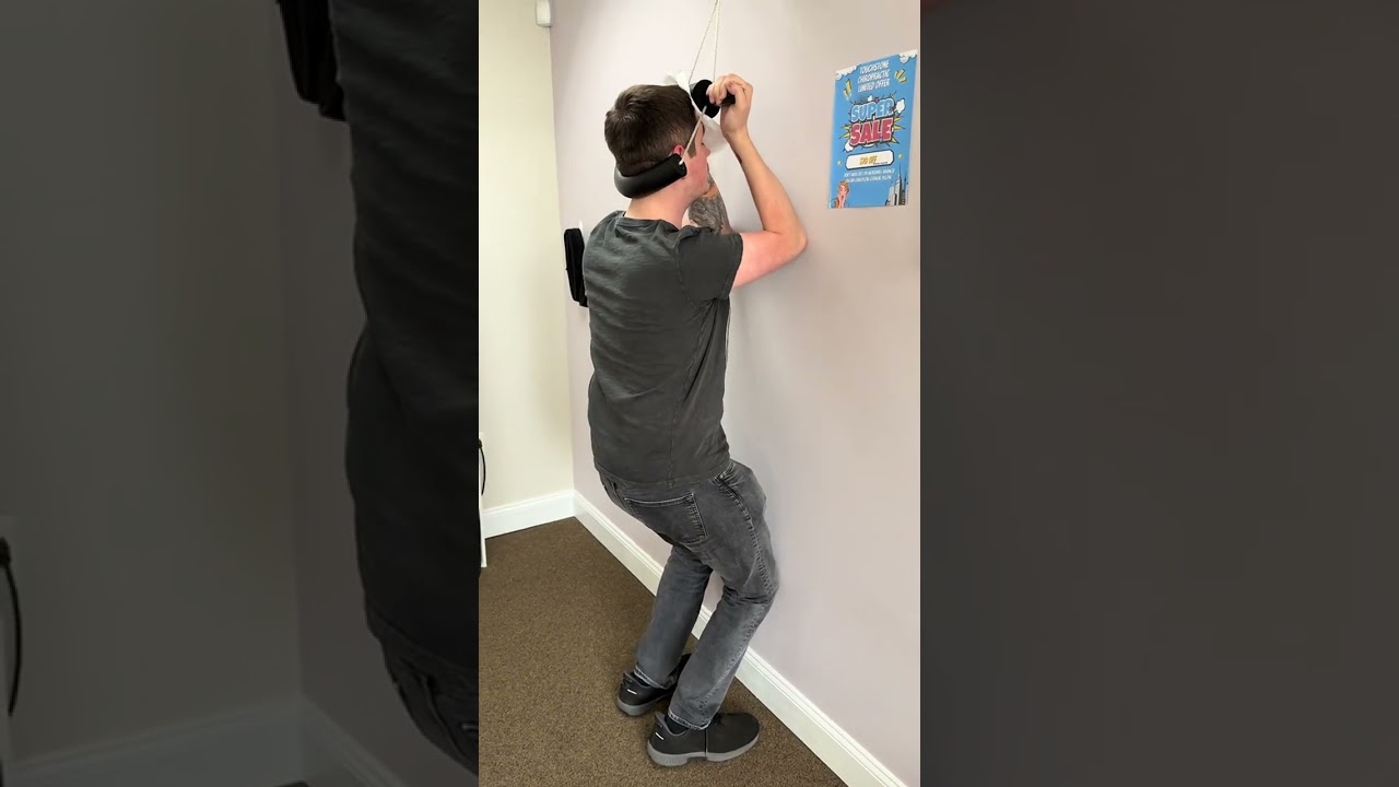 Patient performing therapeutic activities to prepare his spine for an adjustment