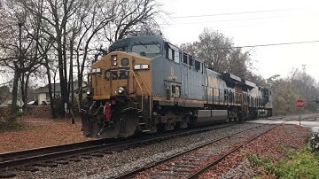 CSX ES44AC-H # 3148 Leads Q581 in the Snow @ Matthews along with CSX AC44CW # 8