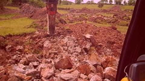 Breaking Rock With A JCB JS 130