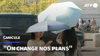 Canicule: à Paris, les touristes obligés de s'adapter