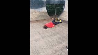 Scooter rider drops into quarter pipe then falls forward and faceplants