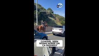 Cowgirl Seen Riding Horse On Ca Highway