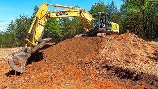 Working hard to get the final grade perfect on this house lot