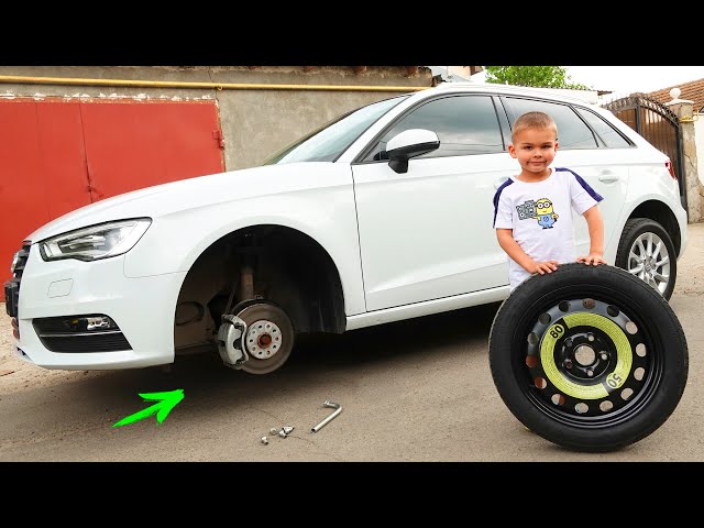 The wheel went down on AUDI A3 - Dima on tractor helping man class=