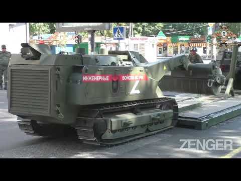 Pro-Russian, So-Called DPR Makes Show Of Clearing City Streets Of Mines As Locals Walk Around
