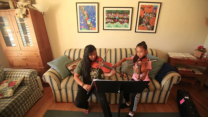 Teresa and Mariah Alberigi practice their violins