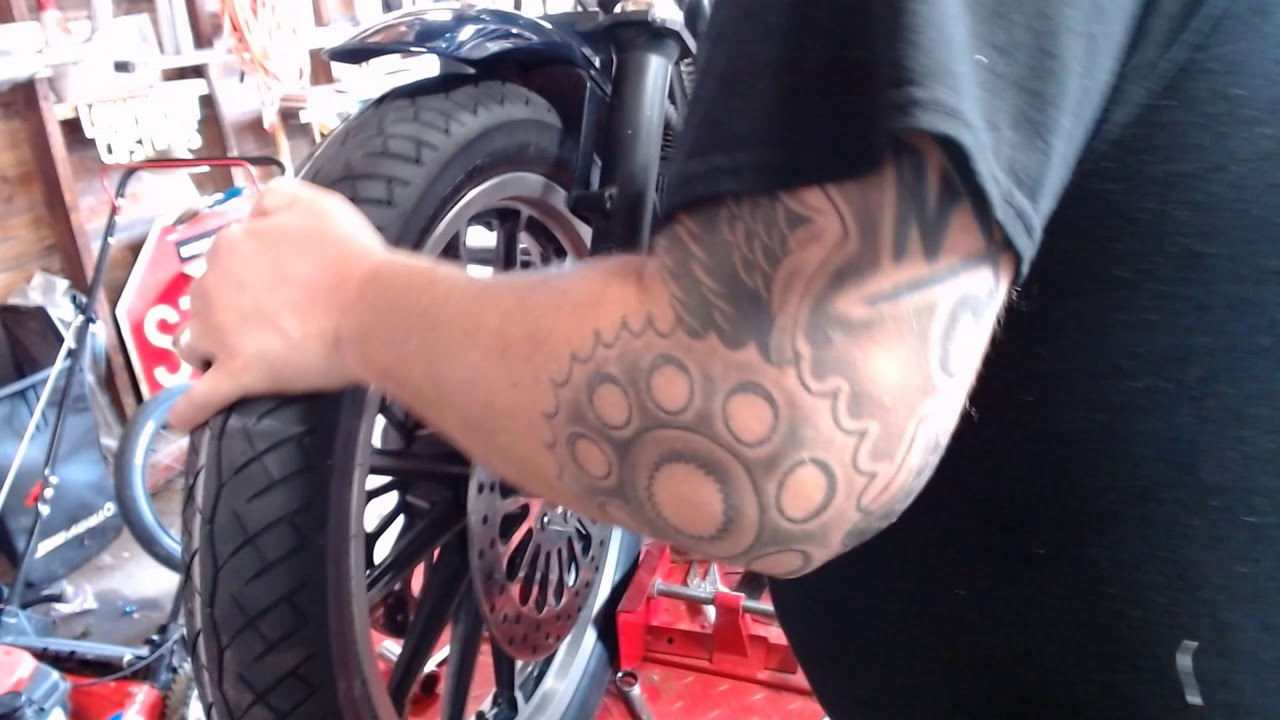 Remove the wheel off your Harley Dyna, or most any motorcycle. YouTube