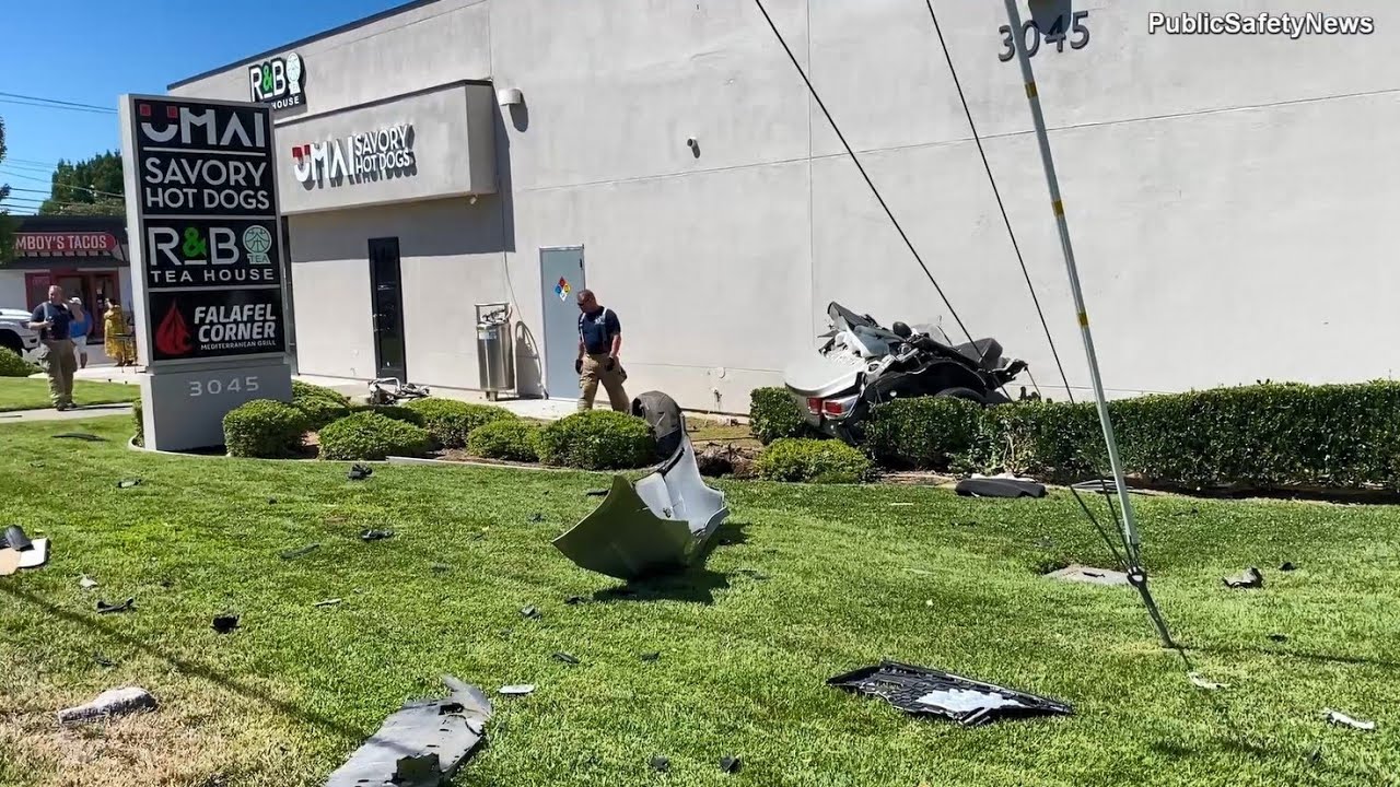 Driver Slams into Pole, Splitting Car in Two and Hitting Building - YouTube