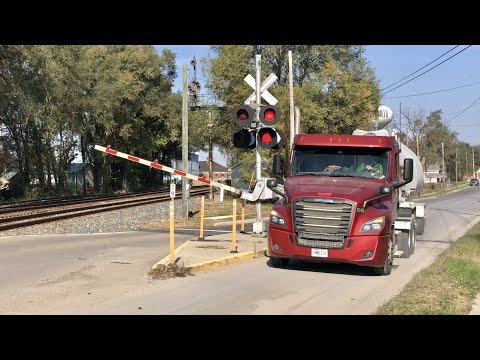 Truck Driver Beats RR Crossing Gates With Train Coming!  Train Knocks Down The Signal! DPU On CSX