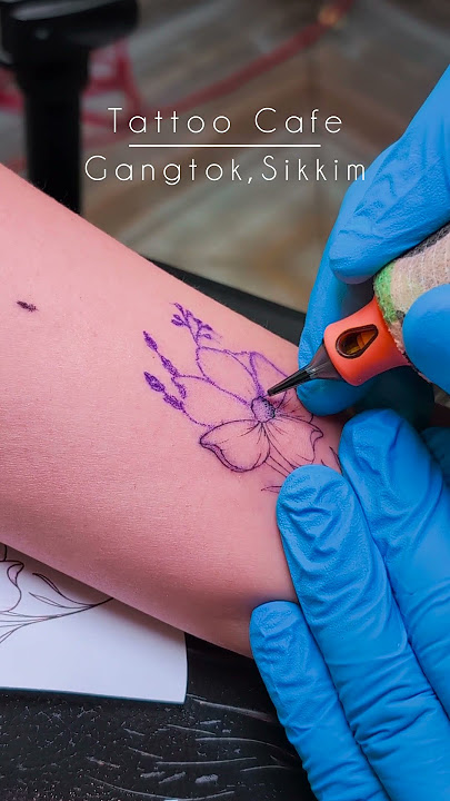 Fine line Cosmos Flower tattoo done at Tattoo Cafe Gangtok #finelinetattoo #tattoos #floraltattoo