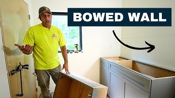 Scribing cabinets to an uneven wall.