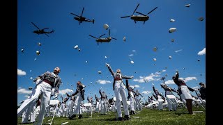 West Point cadets toss their hats in the air to celebrate their 2020 graduation