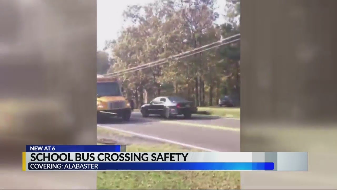 Car blows past stopped school bus in Alabaster