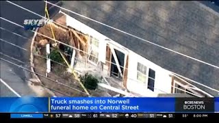 Truck crashes into Norwell funeral home