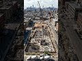 From empty land to a towering glass skyscraper.