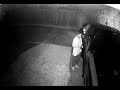Surveillance video captures man breaking into truck.