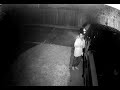 Surveillance video captures man breaking into truck.