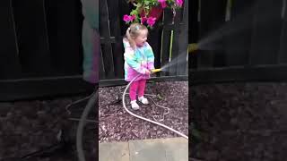 Girl Points Hose At Dad Contentbible