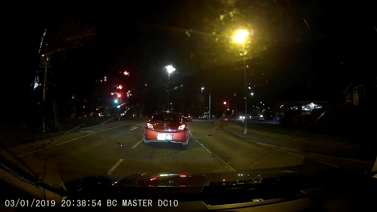 Not paying attention, car drives through a red light. - YouTube