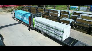 Loading timber into a shipping container