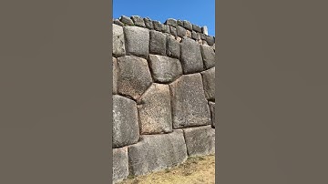 The interlocking stone wall of the Inca Saksaywaman citadel above Cusco Peru