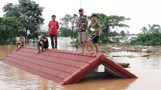 ラオス・ダム決壊、屋根の上に取り残された住民たち