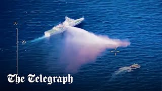 video: Watch: Chinese coast guard fires water cannon at supply ship in territory row