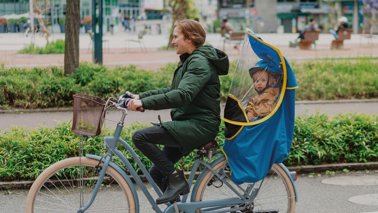 Sunnybaby 14490 Cape de pluie à capuche pour siège vélo pour enfant Avec  manches et bandes réfléchissantes Peut se porter avec un casque de  protection Noir : : Sports et Loisirs