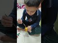 kids water colour painting with leafs and enjoying #colors #funny #plants #trending