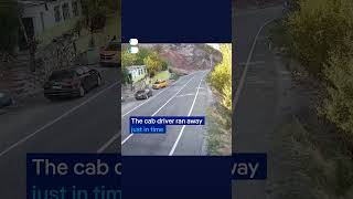 Cab driver narrowly escapes falling boulder | DW News