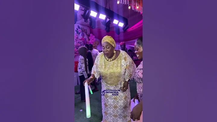 Madam Saje and Feranmi Empire on the dancing floor at her birthday party and store opening