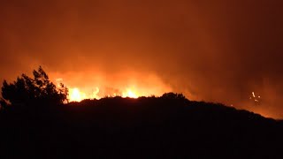 Wildfires continue to rage on Greek island after thousands flee