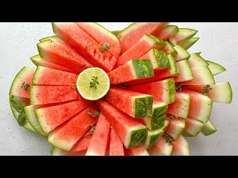 Ice cold watermelon wedges on wide popsicle sticks.
