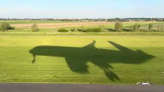 Landing into Amsterdam Schiphol Lovely morning check out the shadow of the Singapore Airlines plane!